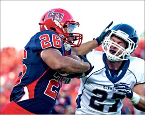 Shiver — Liberty running back Desmond Rice stiff arms Monmouth cornerback Andrew Sutton in a 45-15 rout. Photo credit: Ruth Bibby