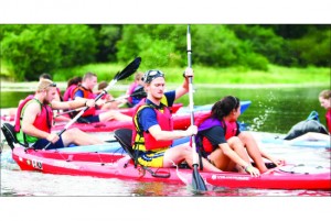 Paddle — An adventure race challenged 10 teams of six students through running, carrying a log and kayaking across the lake at camp. Photo credit: Courtney Russo