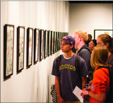 on display — Aspiring artists and comic fans alike gathered Thursday, Sept. 19, to admire the work of experienced artist Lee Weeks. Photo credit: Kyle Erikson
