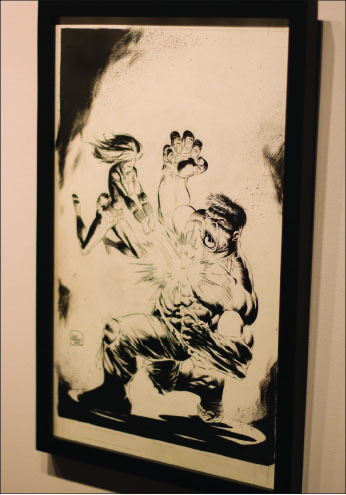 on display — Aspiring artists and comic fans alike gathered Thursday, Sept. 19, to admire the work of experienced artist Lee Weeks. Photo credit: Kyle Erikson
