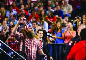 REALITY — Robertson responds to applause as he enters the Vines Center. Photo credit: Ruth Bibby