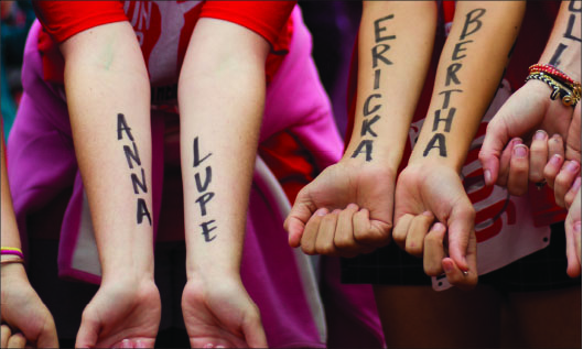 Inspiration — Many runners choose to have victims’ names written on their arms during the race. Photo credit: Sam chappell