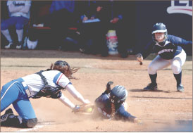 Sliding home — The Lady Flames are hoping to produce more runs this season with their renewed focus. Photo credit: Jake Mitchell