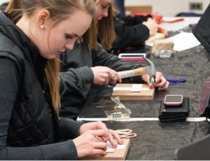 Creative — Students participating in the event used hammers, nails and string to create colorful works of art. Photo credit: Christieanna Apon