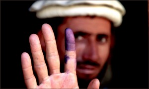 DEVELOPMENT — An Afghanistani voter shows his inked finger to show that he has voted. Google Images