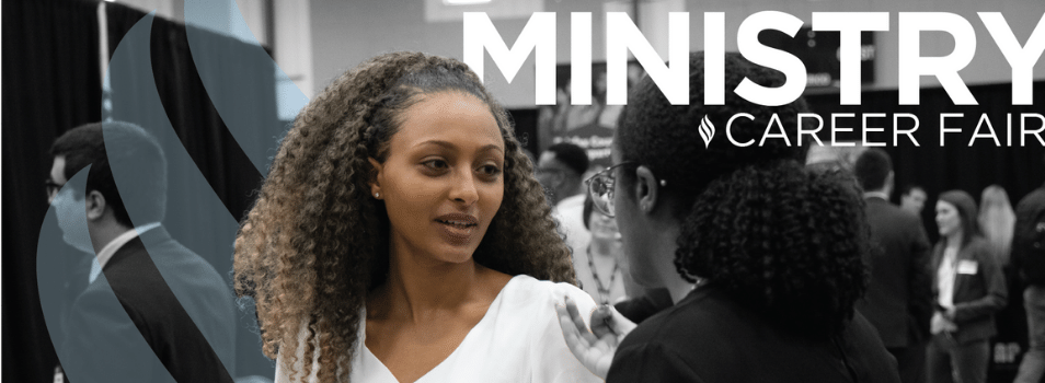A woman looking at another woman at a career fair