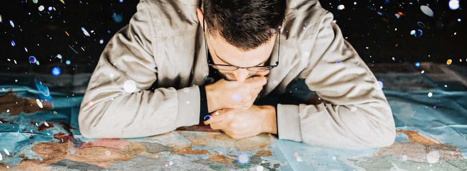 Man looking down at a global map