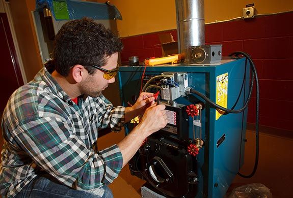 Student doing electrical work