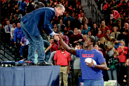 Mutual Appreciation — Football reaches across generations during Convocation. Photo credit: Courtney Russo