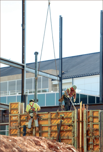 Construction workers build framework for the upcoming Performance Hall located across from the Jerry Falwell Library.