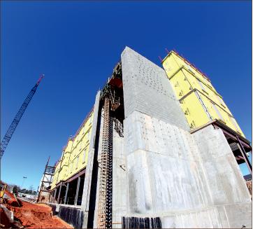 6. Commons 2 Dorm is under construction alongside the completed Commons 1 Dorm.