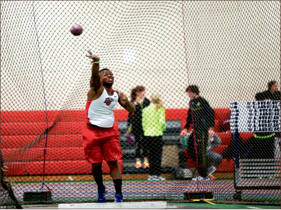 Tossing Around — Decathlete Lewis Williams competes in the shot put event. Photo credit: Courtney Russo
