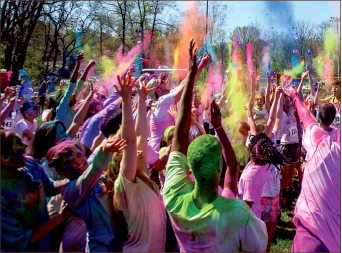 vibrant — 5K participants tossed various color packets into the air after the race. Photo credit: Michela Diddle