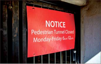 Posted — Signs informed pedestrians of the tunnel closure Monday-Friday. Photo credit: Michela Diddle
