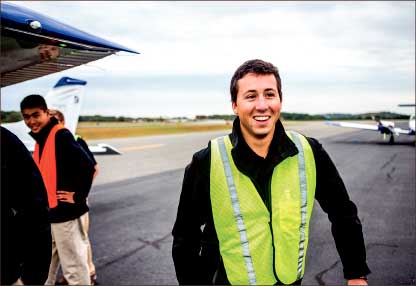 Score — Liberty’s flight captain Evan Thrams smiles at his power-off landing results. Photo credit: Michela Diddle