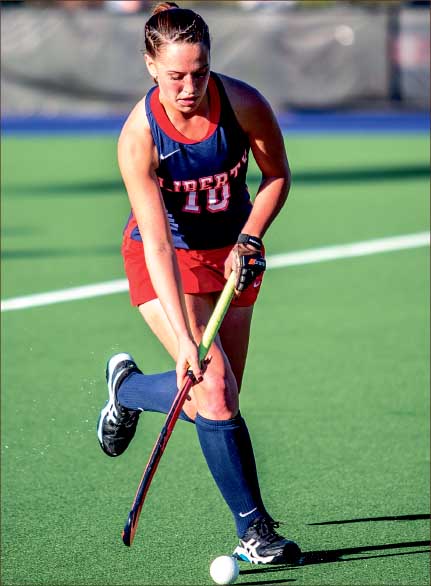 determination — Freshman forward Abby Julius moves the ball upfield against the Cavaliers. Photo credit: Michela Diddle