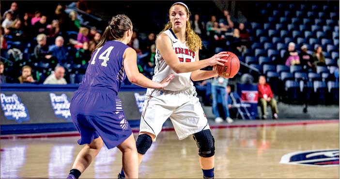 welcome back — Ashley Rininger looks to pass during the Lady Flames win over High Point. Rininger finished with eight points and six rebounds in her return from injury. Photo credit: Michela Diddle