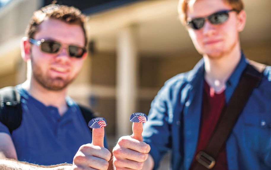 ELECTION DAY — Students pictured holding their “I voted” stickers after voting in the March 2016 primary elections. Photo credit: Kevin Manguiob