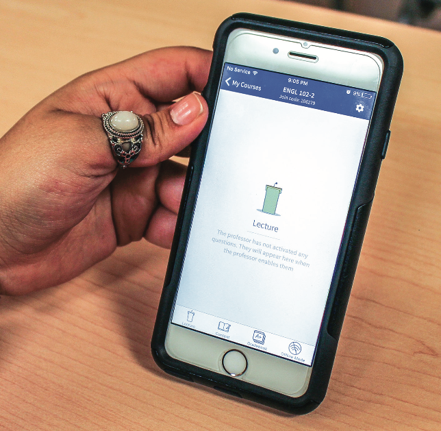 GETTING AN UPGRADE — Students now use the Top Hat app on their phones instead of the Turning Technologies clickers that have been used by professors in past years. Photo credit: Christeanne Gormley
