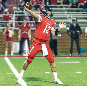 SHOTGUN — Buckshot Calvert threw for 340 yards and four touchdowns against Robert Morris in his first career start. Photo credit: Michela Diddle