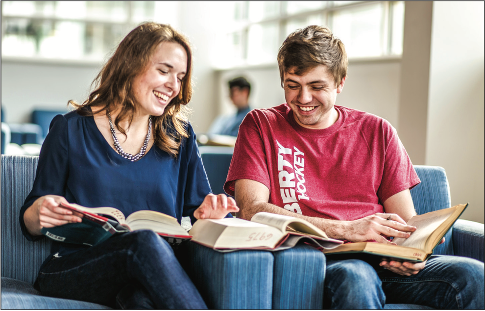 classmates — History graduate students Erin Yates and Ryan Vohringer studied together at the Jerry Falwell Library. With CPCE classes, both residential and online students can take extra classes to receive certificates in a variety of subjects. Photo Credit: Joel Coleman |