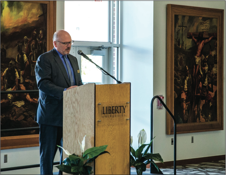 Dedicate — School of communications & creative arts Dean Norman Mintle introduced President Jerry Falwell at the dedication ceremony for the Life of Christ paintings Oct. 28. Photo Credit: Will Young