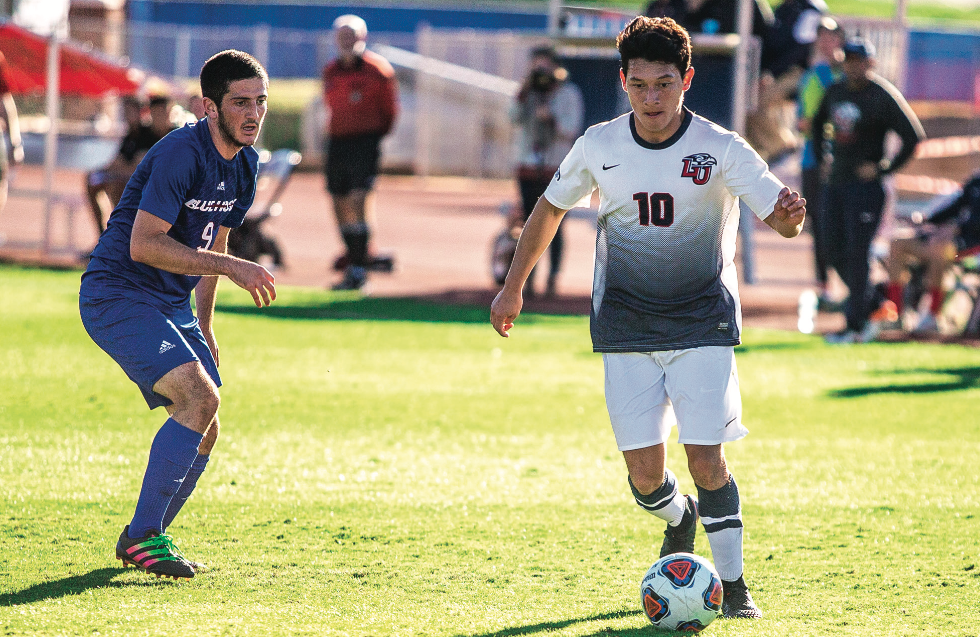 KICK — Sophomore midfielder Kevin Mendoza dribbled past a Blue Hose defender. Photo Credit: Amber Tiller