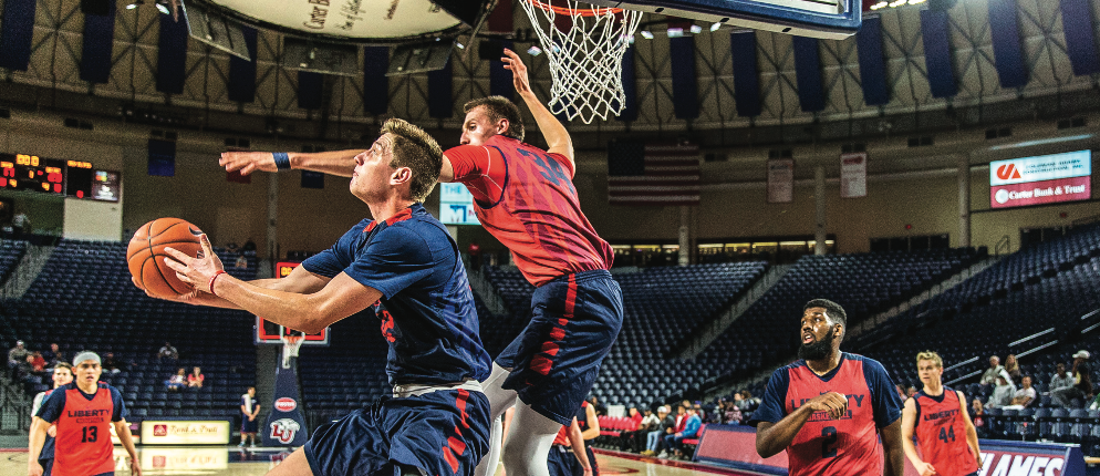 REVERSE — Freshman forward Brock Gardner attempted a reverse layup in the Flames scrimmage in the Vines Center. Photo Credit: Amber Tiller