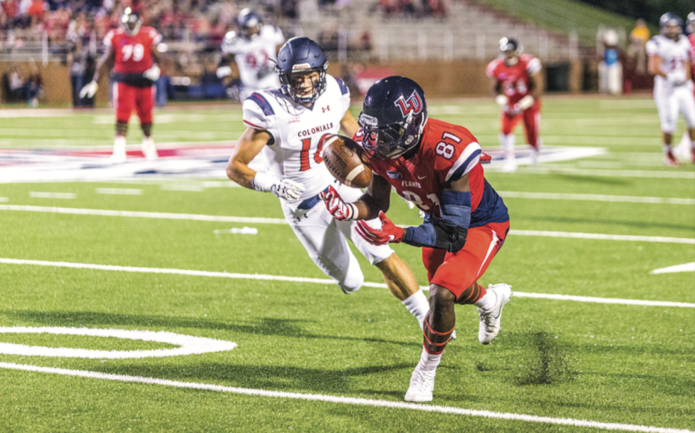 CATCH — Junior wide receiver Marquis Fitzgerald hauled in a catch in the Flames game against Robert Morris Oct. 1. Photo credit: Michela Diddle