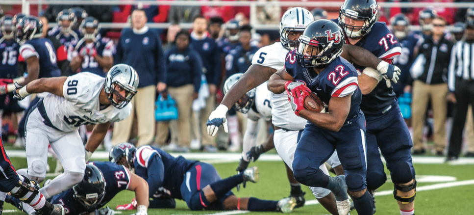 CUTBACK — Junior running back Todd Macon broke an outside run toward the sidelines. Photo credit: Michela Diddle