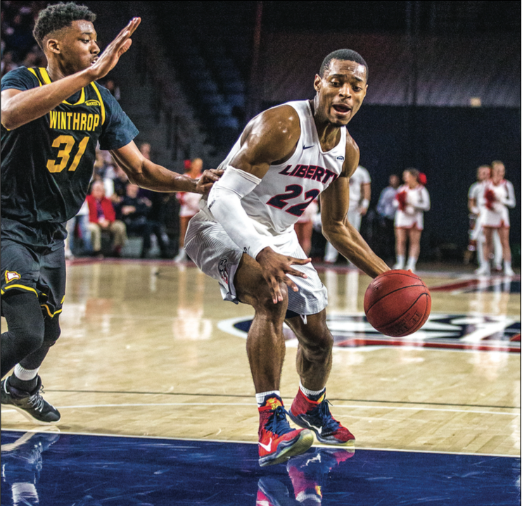 STRUGGLE — Flames guard John Dawson only scored one point, going 0-8 shooting. Photo Credit: Amber Tiller