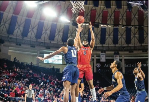BIG — Flames forward Myo Baxter-Bell pulled up for a jump shot against the Bucs. Photo Credit: Michela Diddle
