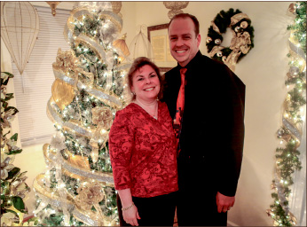 spirit — Tom Donovan and Sundi Donovan pose in front of one of their 80 trees. Photo credit: Courtney Russo