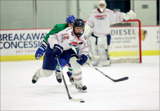 puck control — Brad Docksteader pushes the puck up the ice agaisnt Flordia Gulf Coast. Photo credit: Courtney Russo
