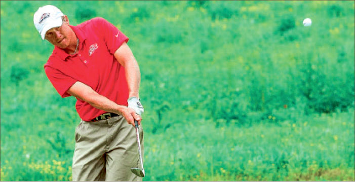 short game — Mathieu Fenasse displays his stroke on the golf course during a tournament earlier in the season. Photo provided