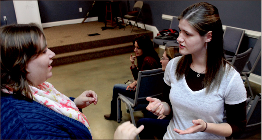 praise — Though they cannot hear, the congregation finds its own unique way to glorify God through a deaf service. Amber Tiller