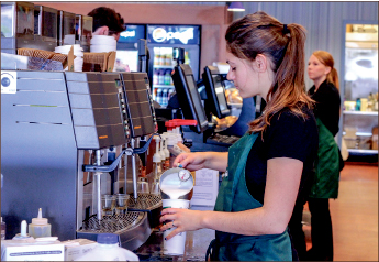 aroma — Many students use drinking coffee as a way to spend time with friends. Photo credit: Taylor Anderson