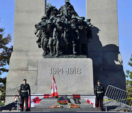 Remember the fallen — Soldiers stand guard at the War Memorial in Ottawa where Cpl. Nathan Cirillo was killed Wednesday, Oct. 22. Canadian government photo