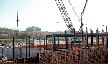 The second Commons dorm, located directly across from Commons 1, undergoes construction efforts for a completion date scheduled around January 2016.