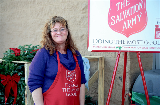 volunteer — Equipped with red bells and buckets, Liberty’s Rotaract club is participating with the Salvation Army this Christmas. Photo credit: Leah Seavers