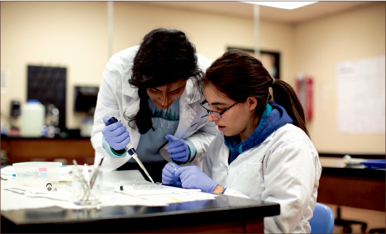 Analysis — Students examine human bodily fluid samples as part of their forensics training under the new Forensic Science major. Photo credit: RJ Goodwin