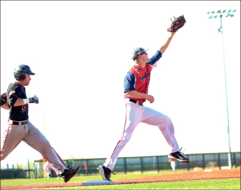 Out at first — Senior first baseman Alex Close reaches up for the force-out. Photo credit: Courtney Russo