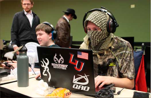 GAme on — Jason Lynch gamed sporting headwear from a military surplus store for added effect during part of the 25-hour event. Photo credit: Amber Tiller