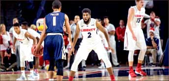 Defense — Flames in-game leading scorer A.C. Reid also contributed on defense. Photo credit: Leah Seavers