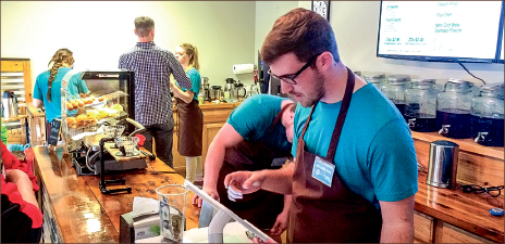 local — Employees at the Open Porch Café in Lynchburg served customers during opening weekend. Photo credit: Isaac Apon