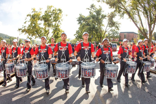 on beat — Liberty’s marching band drumline performed at Liberty football games and other events. Photo credit: Ty Hester