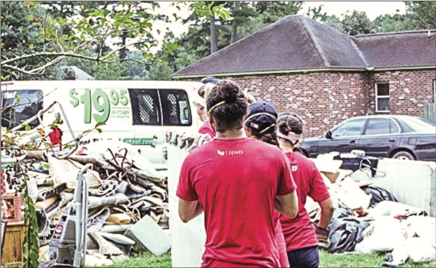 RELIEF — Liberty students partnered with groups in Louisiana to haul away damaged property from houses. Photo Provided