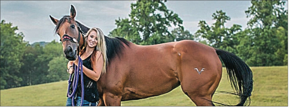 HORSING AROUND — Josie McCormick poses with her horse. McCormick has been ranked No. 8 in the world at the National Barrel Horse Association World Championships. Photo Provided