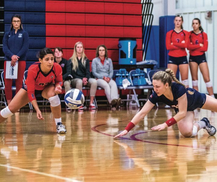 STRETCH — Sophomore libero Margaret Latchford dove for the ball during the game. Photo credit: Michela Diddle