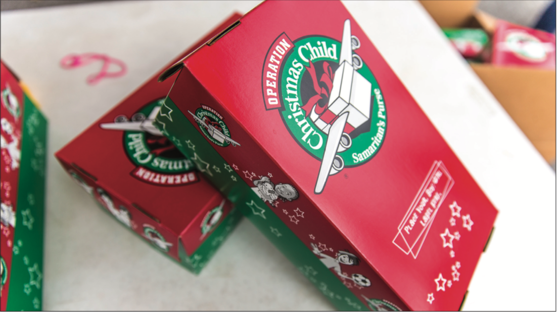 GIVE — Liberty students filled shoeboxes with items to be shipped to children in third-world countries for Christmas. Photo Credit: Amber Tiller